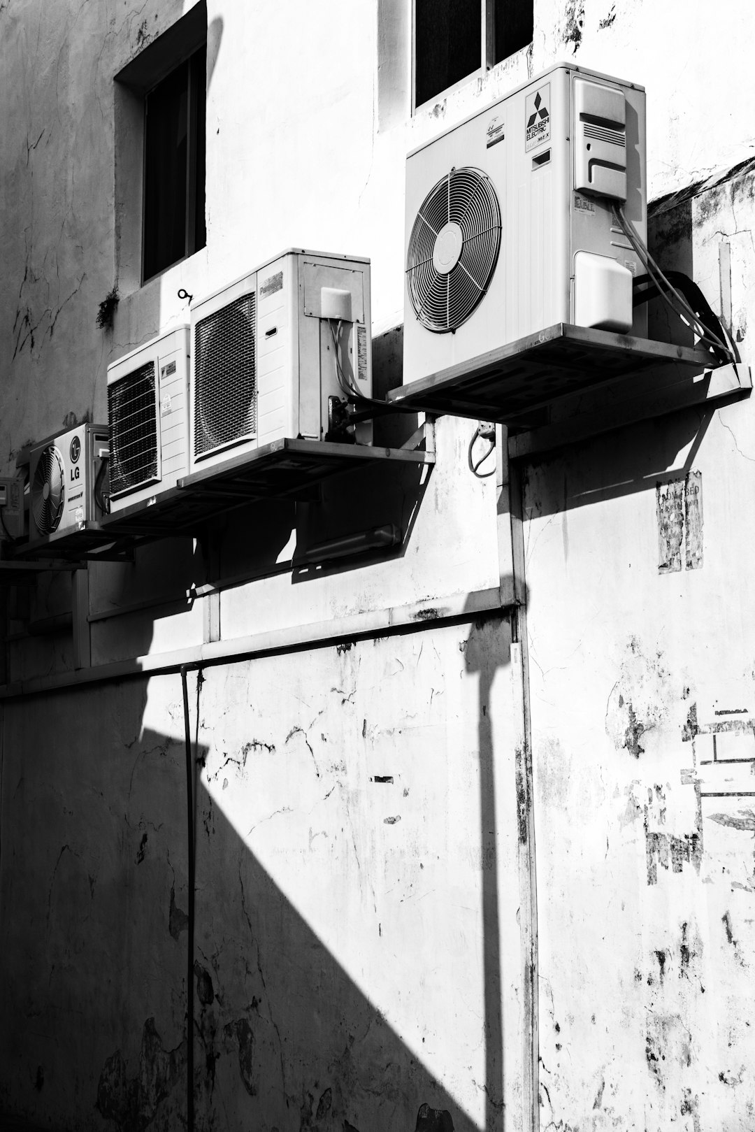greyscale-photography-of-ac-units-ymmasat-ias